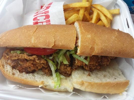 Seasoned fries behind oyster poboy.