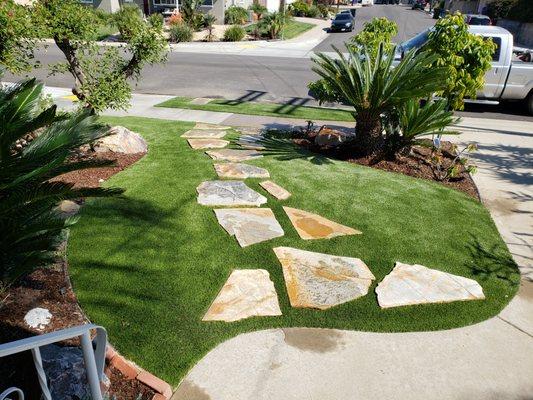 Stepping stones to sidewalk with turf surround in Mt. Pleasant