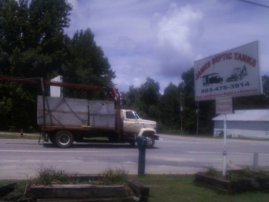 Delivery of septic tanks to the job site.