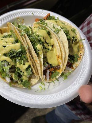 Taco de chicharron en salsa verde and beef fajita tacos