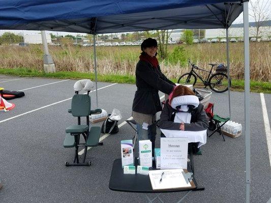 The Roots of Health donate proceeds from chair massage to the Londonderry School at their Fun Run.