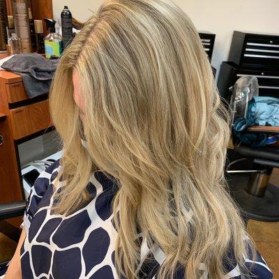 Balayage color with toner for subtle blonde that grows out evenly.