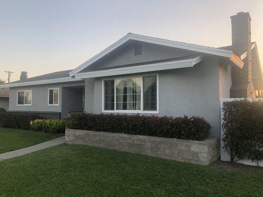 After. Neutral Wave for the stucco, Iron-IC for the brick (front of house and chimney), and Sugar Swizzle for the fascia, fence, and gate!