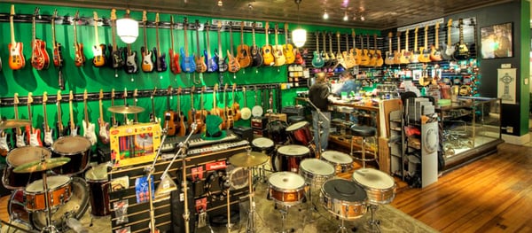 A view from inside of our music store. You will find a full range of musical instruments awaiting you.