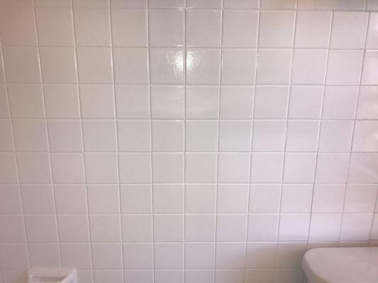 Old crack in the tile is now barely visible after they applied a fresh coat of paint