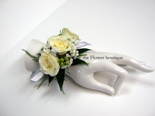 wrist corsage of white baby roses