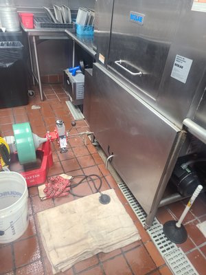 Snaking a drain for a commercial dishwasher