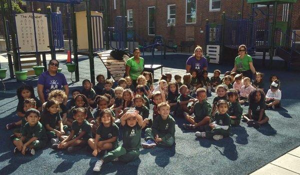 Pre K students on the playground on campus