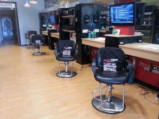 Watch sports on flat screen tvs while you get your haircut