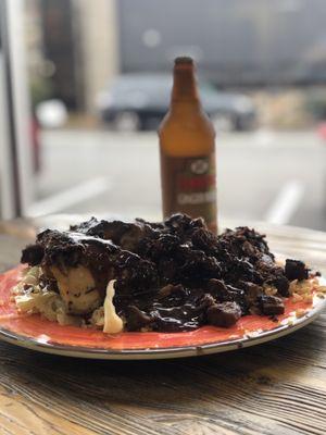 Jerk chicken pork combo with rice and coleslaw. Ginger beer in the back