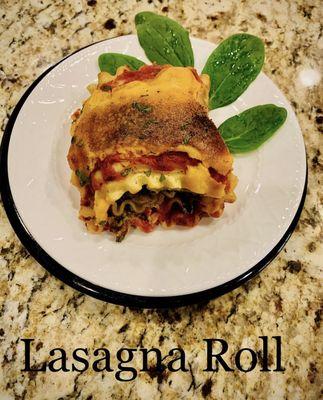 Lasagna Roll, onions, peppers, portobello mushrooms, fresh hummus, kale, fresh tomato sauce