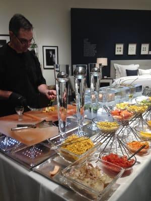 Ceviche Bar at the Mitchell Gold + Bob Williams Home Furnishings Store Opening Event with someone making ceviche