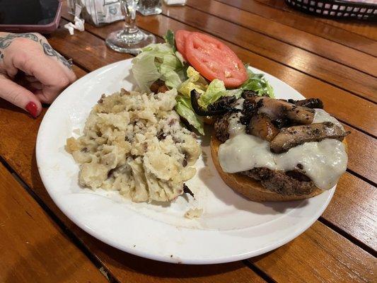 Mushroom and Swiss burger with mashed potatoes.