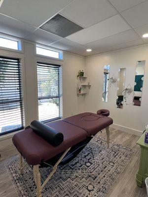 Our massage room with the prenatal belly cutout table so pregnant patients can comfortably lie on their stomach during the massage.