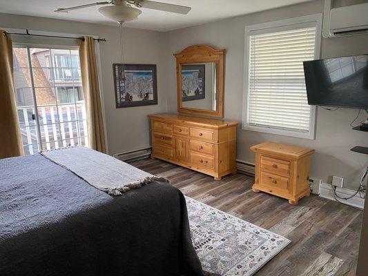 King bed in first bedroom, ceiling fan, TV, Plaza View, connected bath, plenty of storage