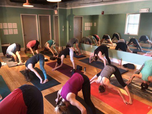 Wide legged forward fold at Loft Yoga.