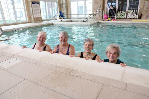 Residents smile from our indoor pool.