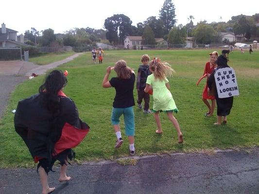 children playing in thier costumes on halloween