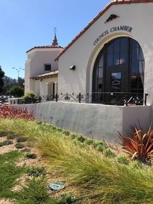 Looking at the original building , parking lot behind