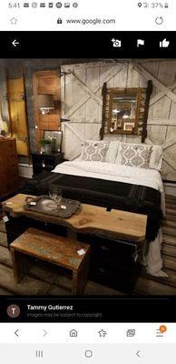 Our master bedroom look...carriage doors headboard, layered mirror on barn door, wood bench and black and white layered bed linens.