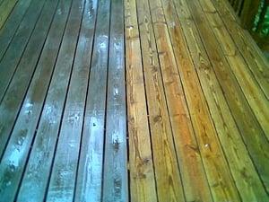 Before and after stripping a deck back to the natural wood surface