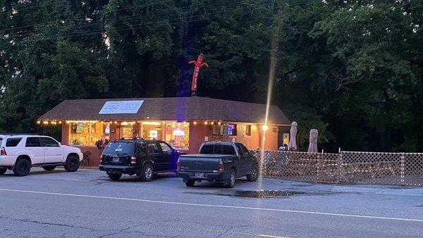 Outside photo in the evening with the patio open - I hear they have great live music and bands in the cooler months too!