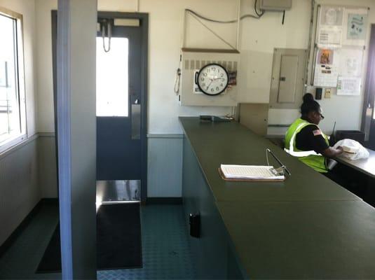 The shack is not glamorous. Employees go through a metal detector and physical pat-down entering and leaving this facility.