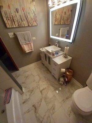 Ceramic tile, vanity, Custom wiring for mirror, new toilet