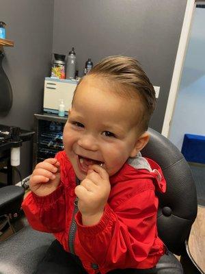 Happy about his haircut.