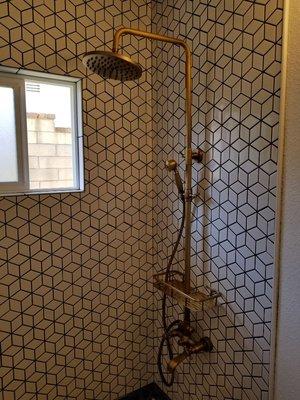 Installed wall mounted tub / shower system.