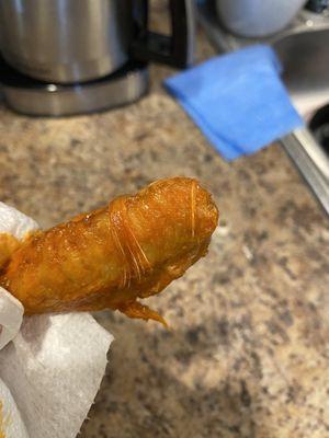 Honestly how can someone serve chicken wing with the feathers on there's no way that no one saw this