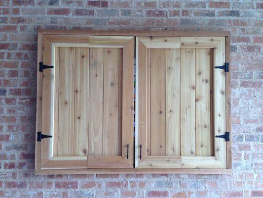 TV on the patio in a custom cedar enclosure.