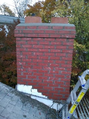 Chimney rebuilt with a concrete crown.