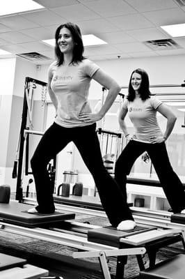 Autumn and Kim performing Side Splits on the Reformer