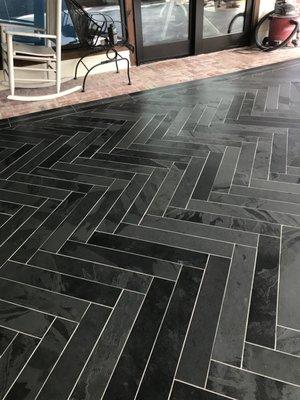 Herringbone tile floor installation