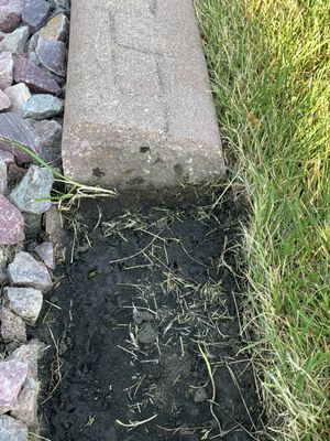 this is where the steel bar was supposed to be, running through the concrete.  not there.  owner said it was from a snow plow.