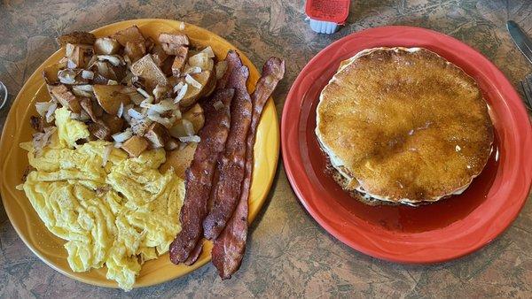 #4 Three eggs and American fries with onions, 4 slices of bacon, 2 pancakes.