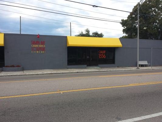 Out front. It's gray with yellow awnings