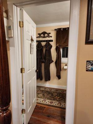 View from bedroom in The Cottage's private bath, complete with cozy full length Terry cloth robes