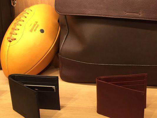 Leather football, wallets, briefcase