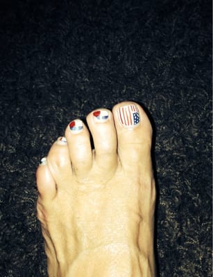 I got this pedicure 3 weeks ago. Still holding up nicely. She drew designs free-hand!! Would definitely go back.