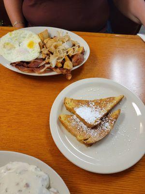 French toast and eggs, home fries with onions and bacon