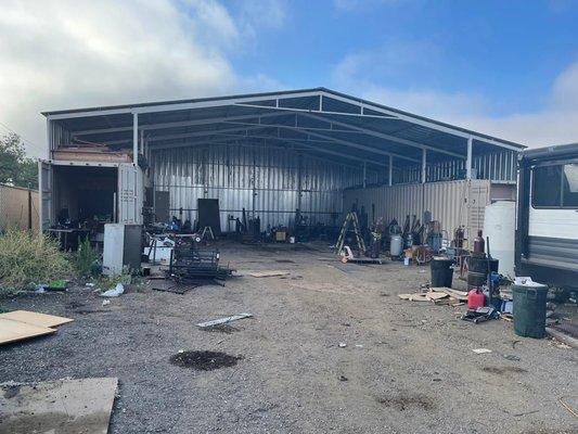 Metal shed demolition. Before