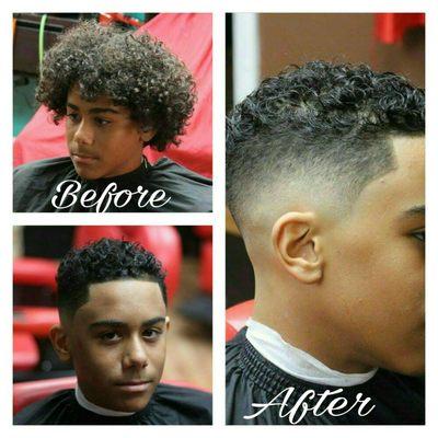 Low skin fade with curly hair on top