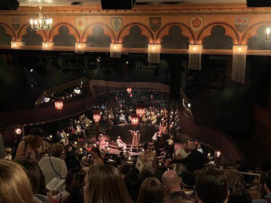 Theater view from the very last row. You'll be squinting & struggling. Shell out for closer seats