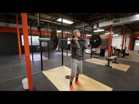 Brian Miller, coach and owner at Crossfit Superfly, demonstrates a front rack position.