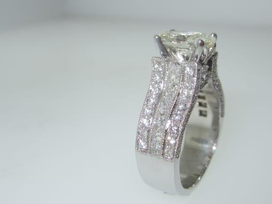 Princess and pave round diamonds custom lady's ring with center oval cut