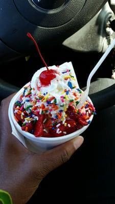 Small strawberry sundae with sprinkles. Yum!