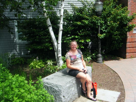 Scruffy person in front of the library