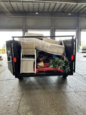 Fully packed back yard & mattress removal cleanout